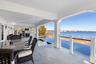 View of patio featuring a water view and outdoor dining space
