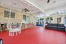 Sunroom / solarium featuring a ceiling fan and a patio