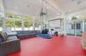 Sunroom / solarium featuring beam ceiling