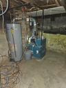 Utility room featuring water heater