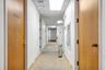 Hallway with a paneled ceiling