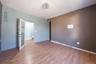 Empty room with light wood-style flooring and baseboards