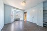 Spare room featuring radiator heating unit and baseboards