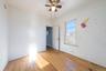 Unfurnished room with hardwood / wood-style flooring and a ceiling fan