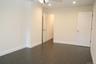 Unfurnished bedroom with recessed lighting, ceiling fan, and dark wood-style floors