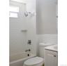 Bathroom featuring vanity, tile walls, and shower / bath combination