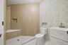 Full bath with vanity, tile patterned flooring, wallpapered walls, and tiled shower