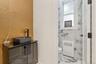 Bathroom featuring marble tiled flooring and vanity