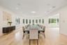 Dining space with healthy amount of natural light, light wood-style flooring, radiator, and recessed lighting