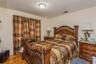 Bedroom featuring light wood-style flooring and baseboards