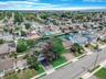 Aerial view of property's location with nearby suburban area and a large body of water