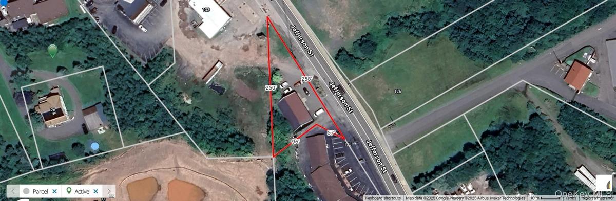 Aerial overview of property's location featuring property parcel outlined