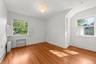 Unfurnished room with baseboards and light wood-style floors