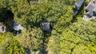 Aerial overview of property's location with a forest