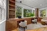 Office space featuring built in study area and light wood-style flooring