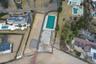 Aerial view of property and surrounding area with a pool area