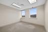 Unfurnished room with a paneled ceiling and carpet floors