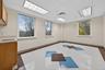 Unfurnished room with a paneled ceiling and baseboards