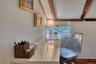 Sitting room featuring beamed ceiling
