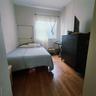 Bedroom with wood finished floors