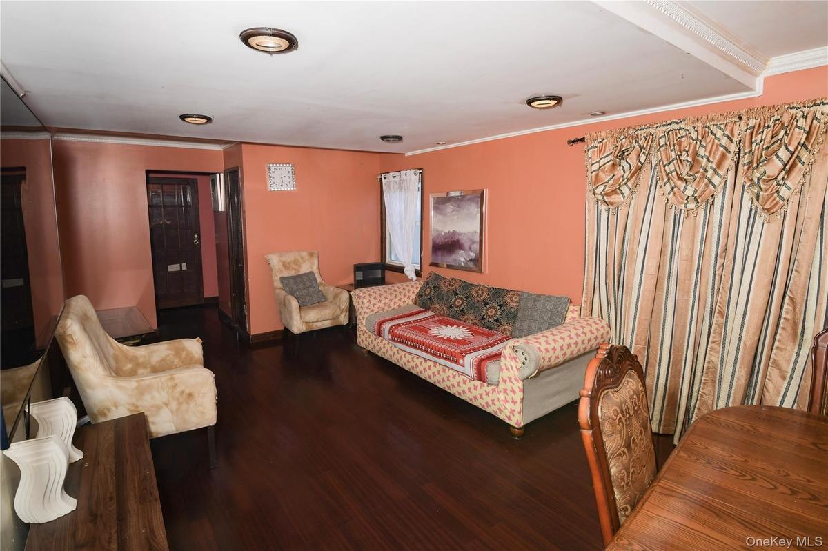 Sitting room featuring ornamental molding