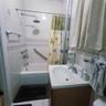 Full bathroom with vanity and shower / bath combination with curtain