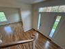 Foyer with healthy amount of natural light and light wood finished floors