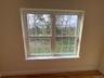 Detailed view of baseboards and wood finished floors