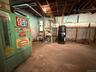 Unfinished basement with a central vacuum unit and a heating unit