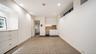 Kitchen featuring white cabinets, recessed lighting, decorative backsplash, and light countertops