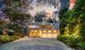 Contemporary home with stucco siding, decorative driveway, and a garage