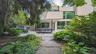 Rear view of house with stucco siding, a patio area, and a pergola