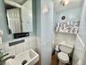 Bathroom featuring vanity, tile walls, and a wainscoted wall