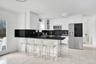Kitchen with appliances with stainless steel finishes, tasteful backsplash, glass insert cabinets, a kitchen breakfast bar, and dark stone countertops