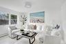 Living room with wood finished floors and baseboards