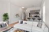 Living area with light wood-type flooring and baseboards