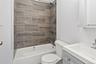 Bathroom with vanity and shower / tub combination