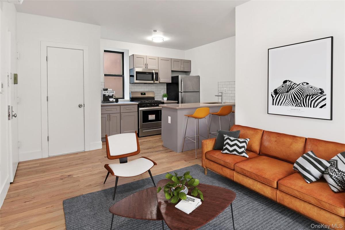 Living room with light wood-style flooring