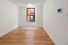 Empty room featuring light wood finished floors and baseboards