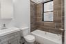 Full bathroom featuring vanity and shower / tub combination