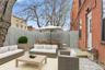 Fenced backyard featuring a patio area and an outdoor living space