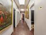 Hall with dark wood finished floors and a paneled ceiling