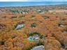 Aerial overview of property's location with property parcel outlined