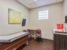 Bedroom featuring dark wood-type flooring and a drop ceiling