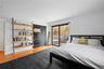 Bedroom with access to outside and light wood-style flooring