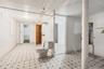 Bathroom featuring tile patterned floors and toilet