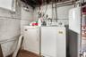 Laundry area with gas water heater and washer and dryer