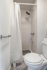 Full bathroom featuring a stall shower