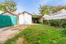 Fenced backyard with a patio area and a storage shed