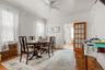 Dining space featuring ceiling fan and crown molding